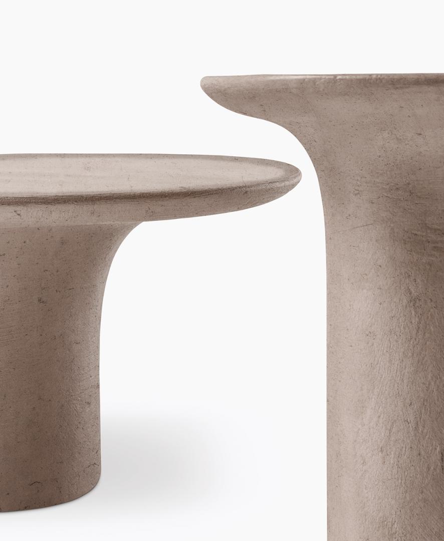  Close-up of Casamilano Callas IN & OUTDOOR side tables. Modern, sculptural design in earthy tones, perfect for contemporary interiors.