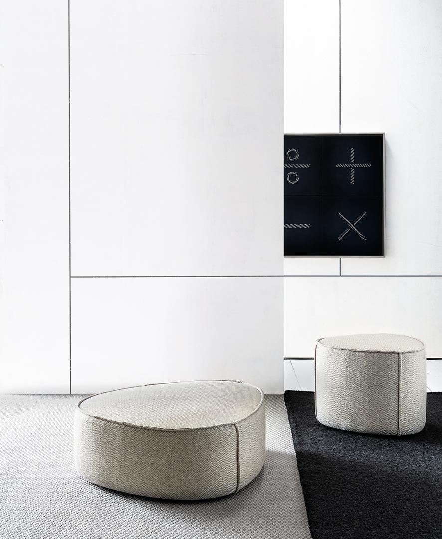  Interior with two Casamilano Francis ottomans. Minimalist design, upholstered in neutral fabric, perfect for modern living spaces