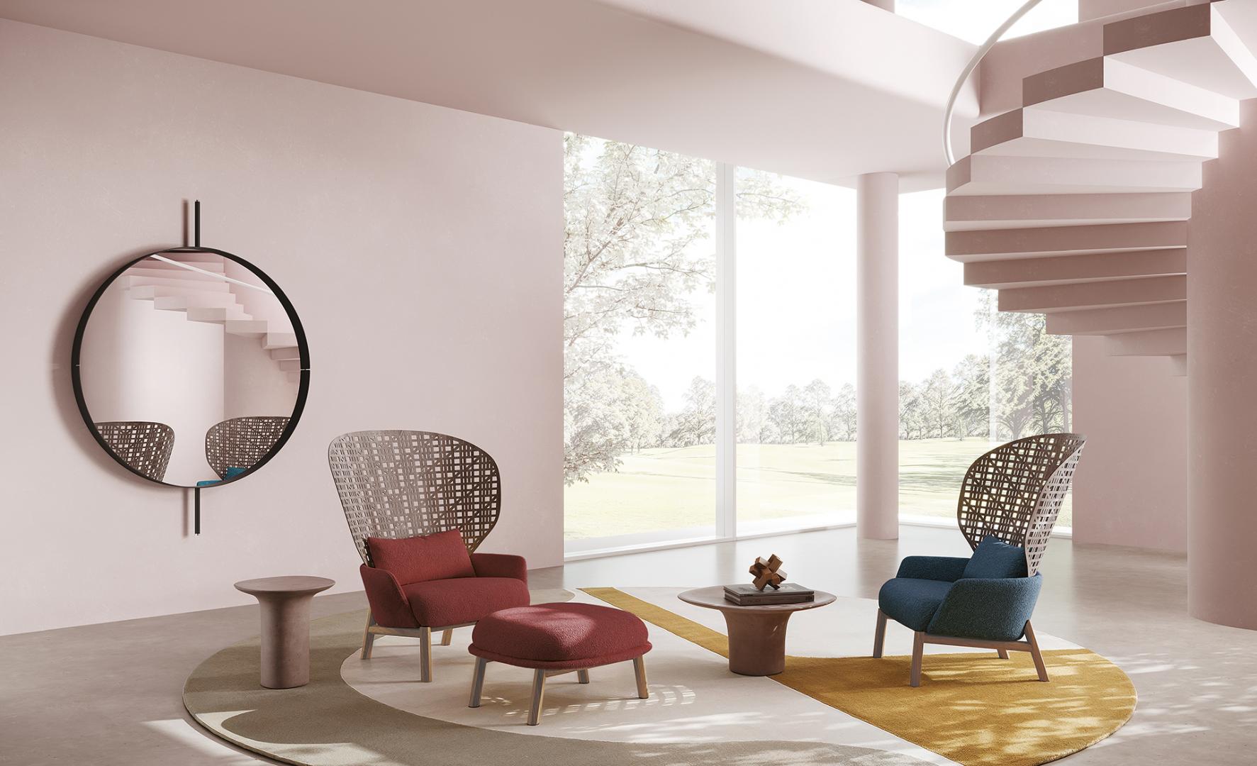  Modern living room featuring Casamilano Elton IN & OUTDOOR pouf, armchairs, coffee table, and round mirror. Interior design and luxury furniture
