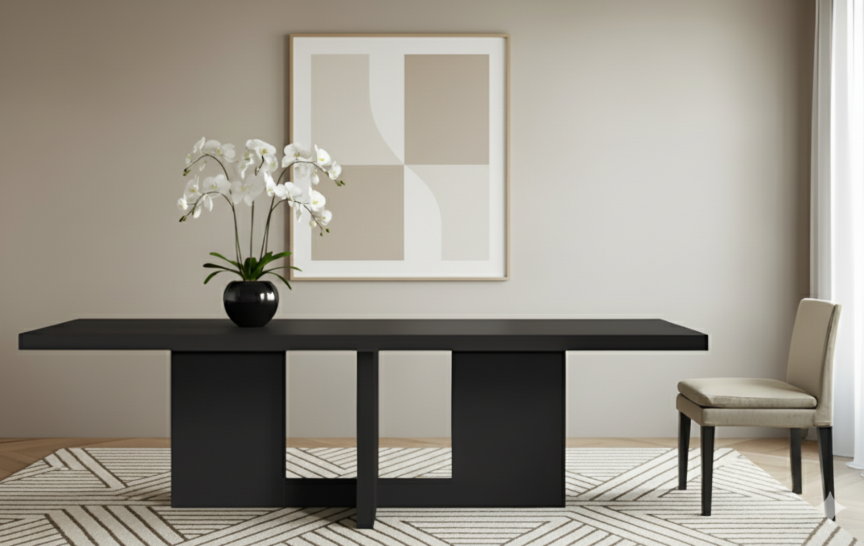 View of black dining table, beige upholstered chair, patterned rug, framed art, orchid decor. 