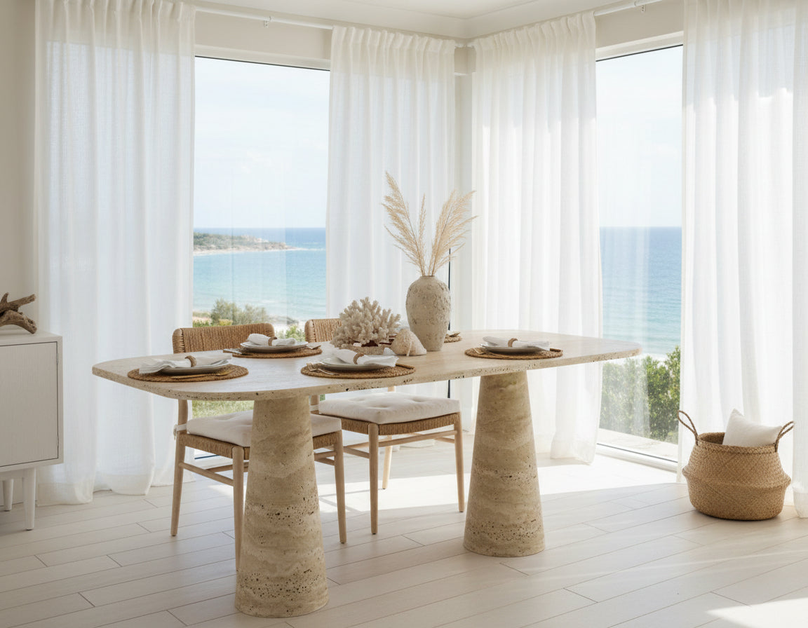 Travertine dining table with textured cylindrical legs, side profile on white background.