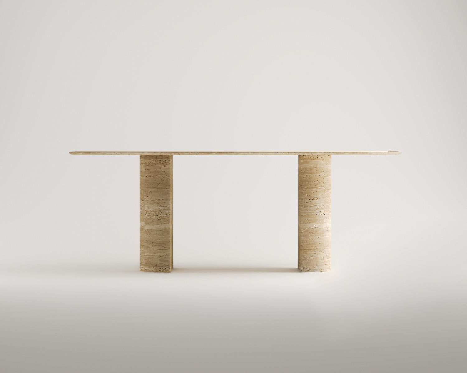 Luzione travertine console table with cylindrical legs. Modern stone furniture for hallways, entryways, or living rooms.