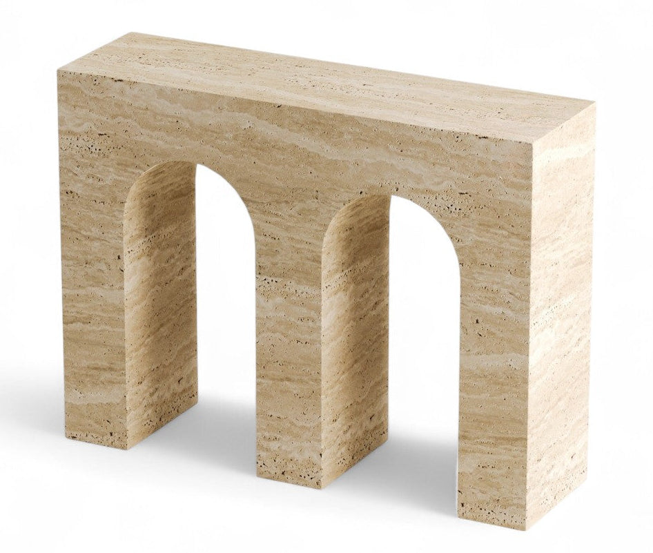 Travertine console table with two arched openings on white background