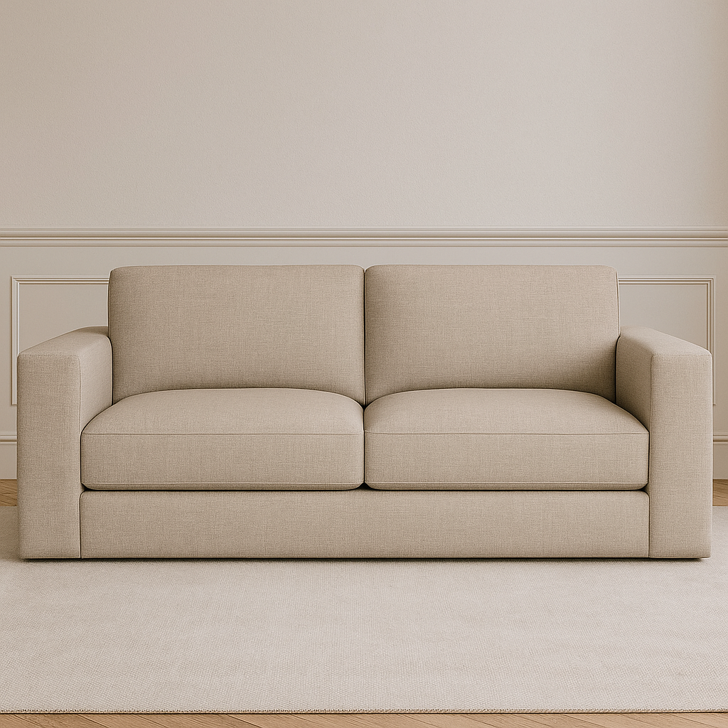 View of beige fabric sofa on rug in room with wainscoting.