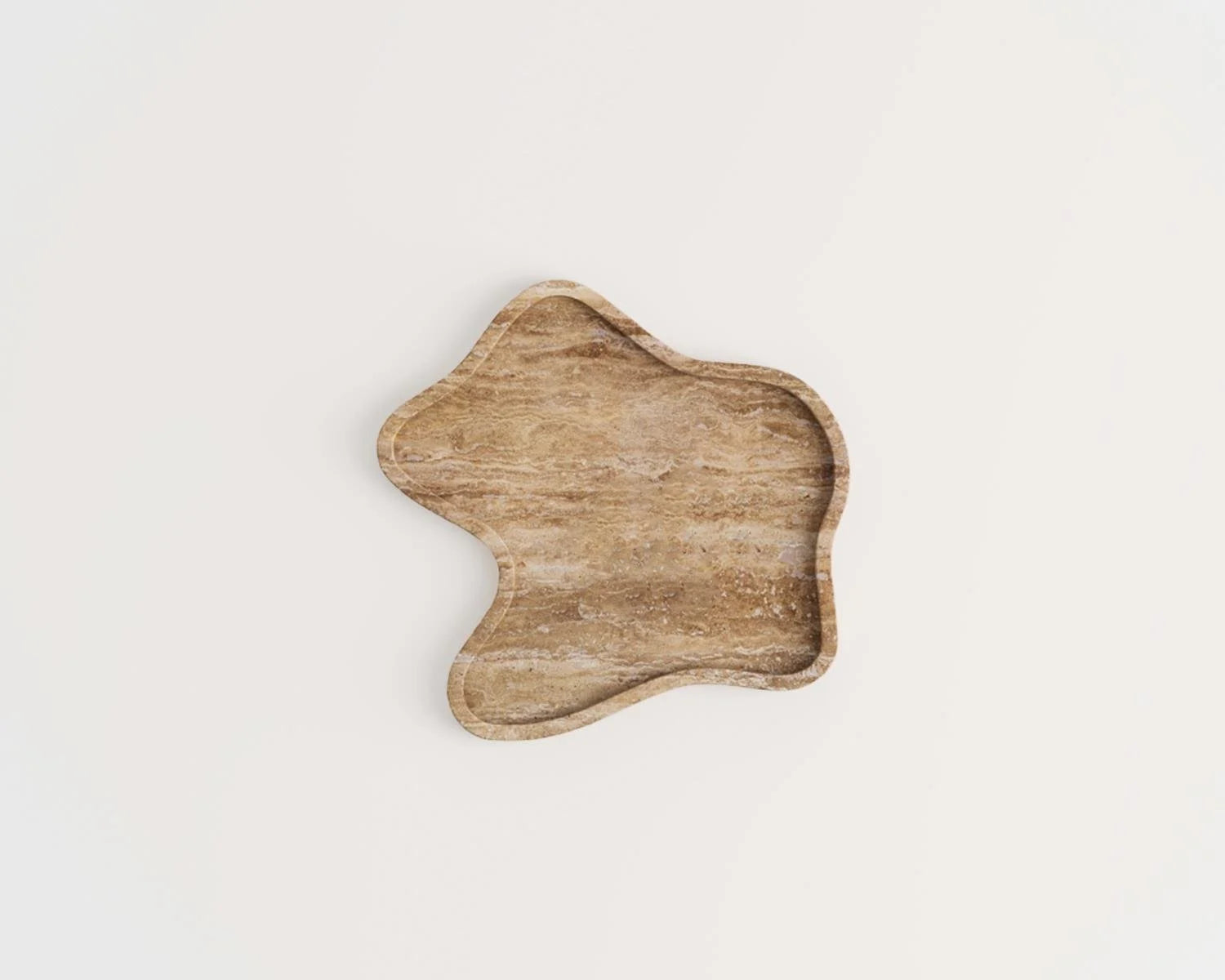 Overhead view of brown wavy stone tray on white background. 