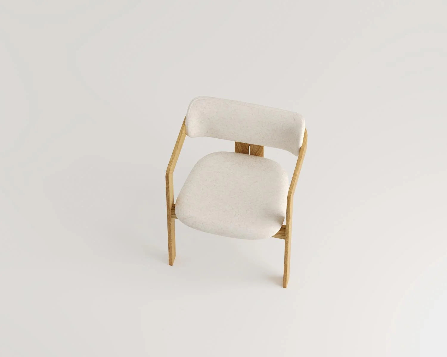 High angle view of wood chair with cream upholstered seat and back on white background. 