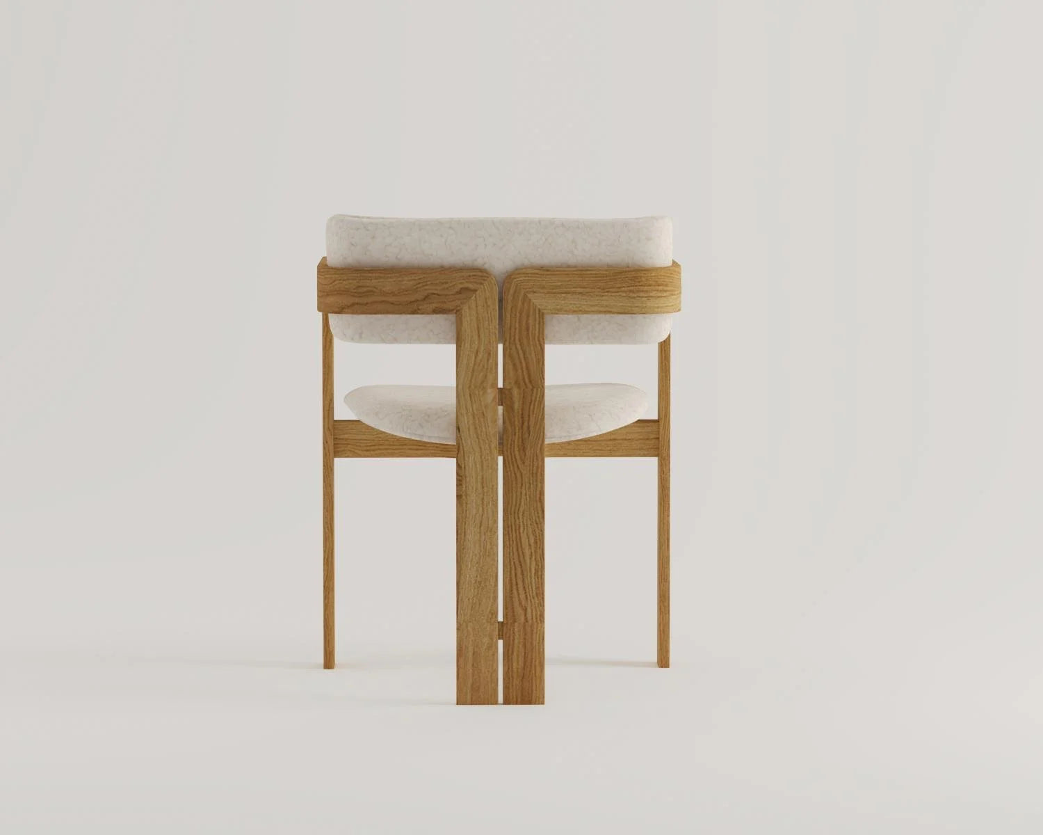 Studio shot of wooden chair with white upholstered seat and backrest