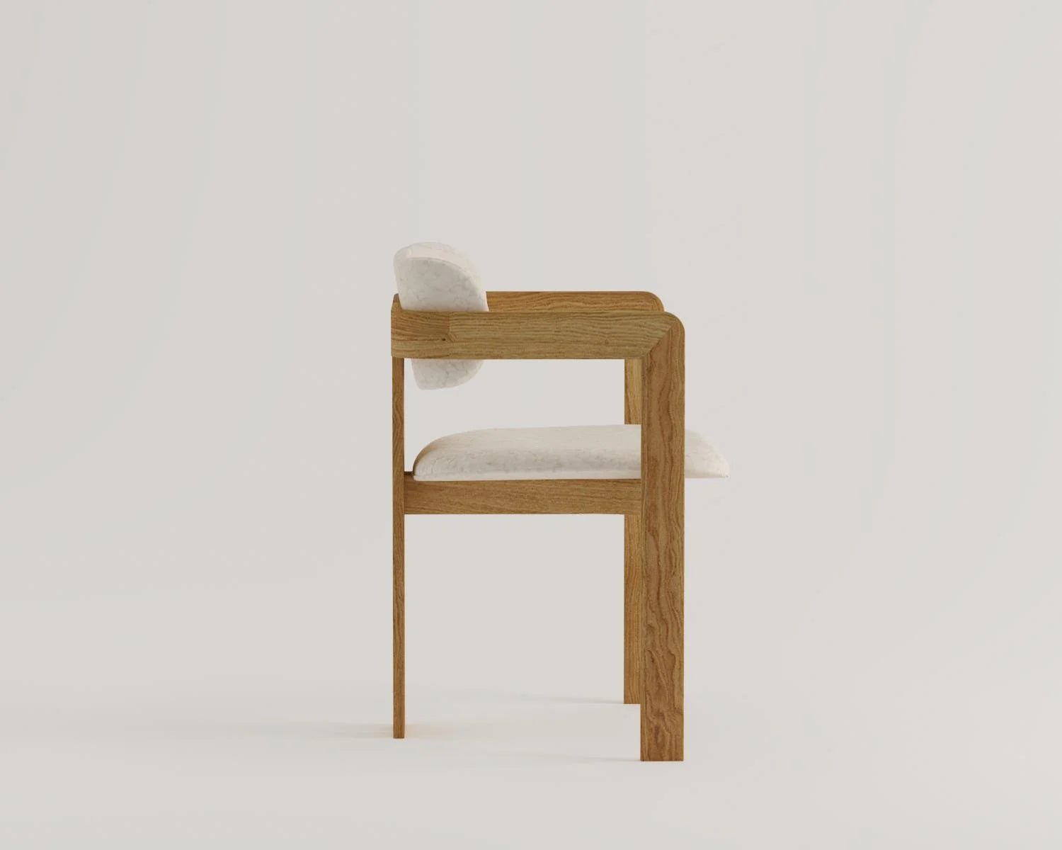 Side view of wooden chair with white upholstered seat and back