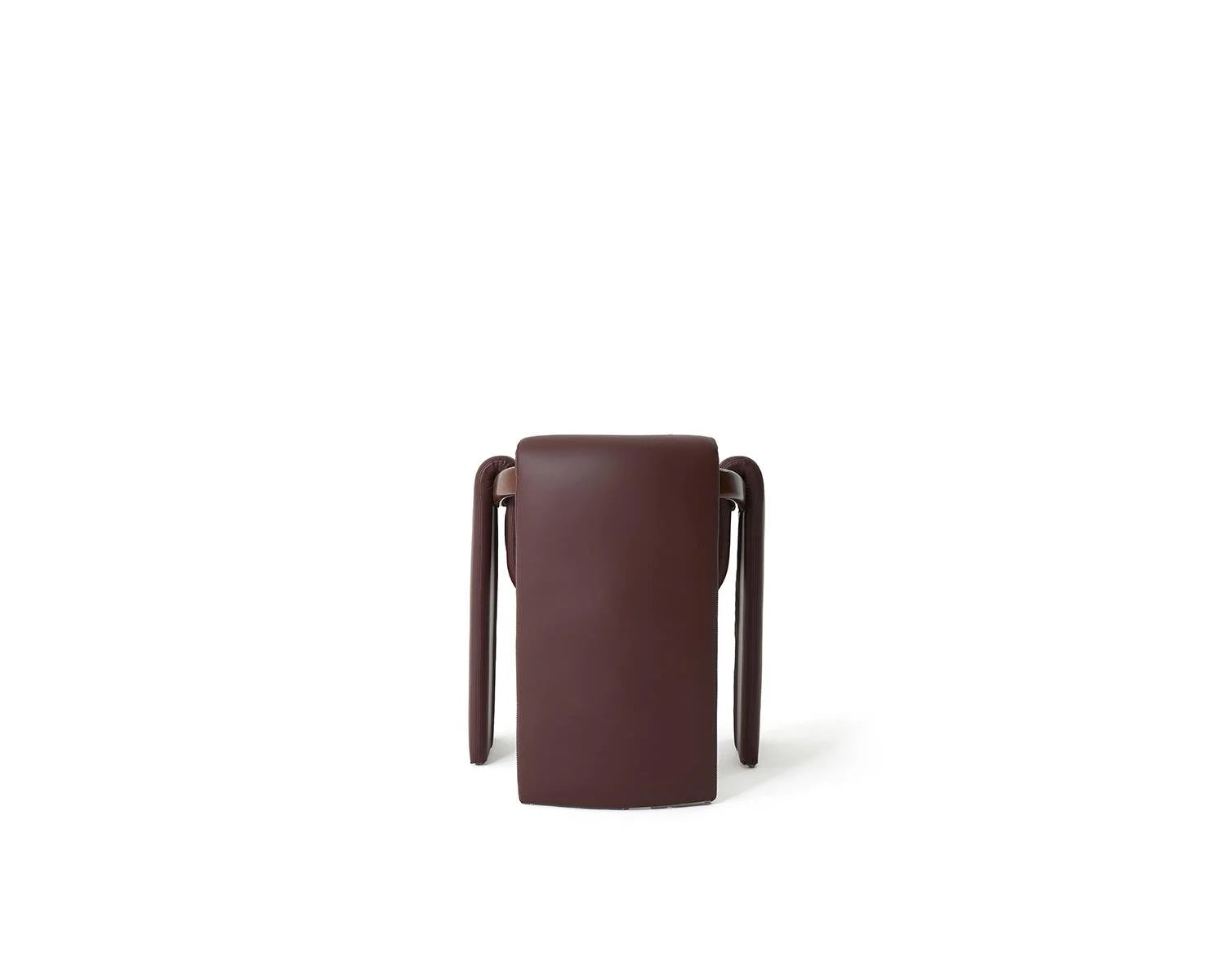 Studio shot of brown leather upholstered stool on white background