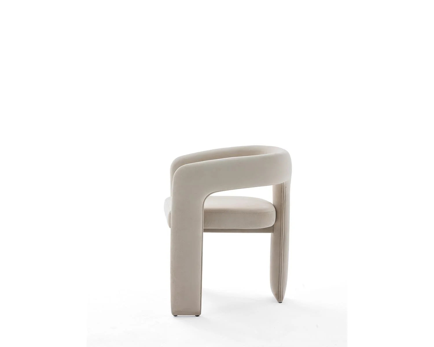 Side view of beige upholstered dining chair on white background
