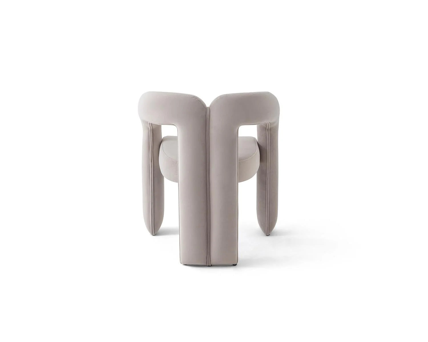 View of light gray velvet upholstered chair with open back design