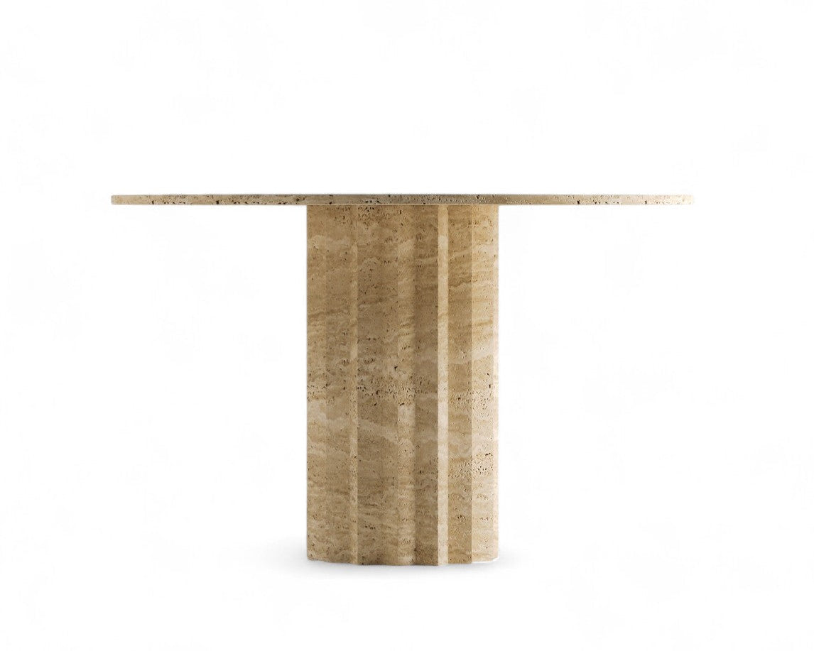 Round beige travertine dining table with fluted pedestal base