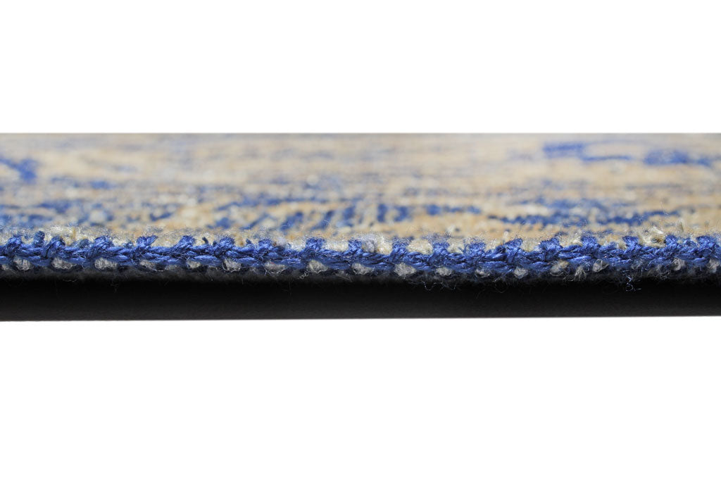 Close up view of blue and beige rug edge