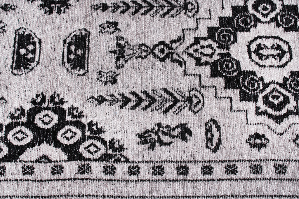 Close up view of black and white patterned area rug texture
