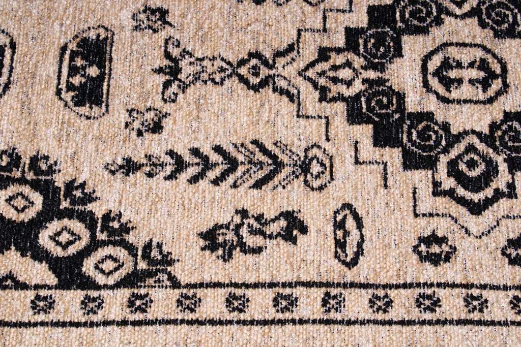 Close up view of beige and black patterned rug texture