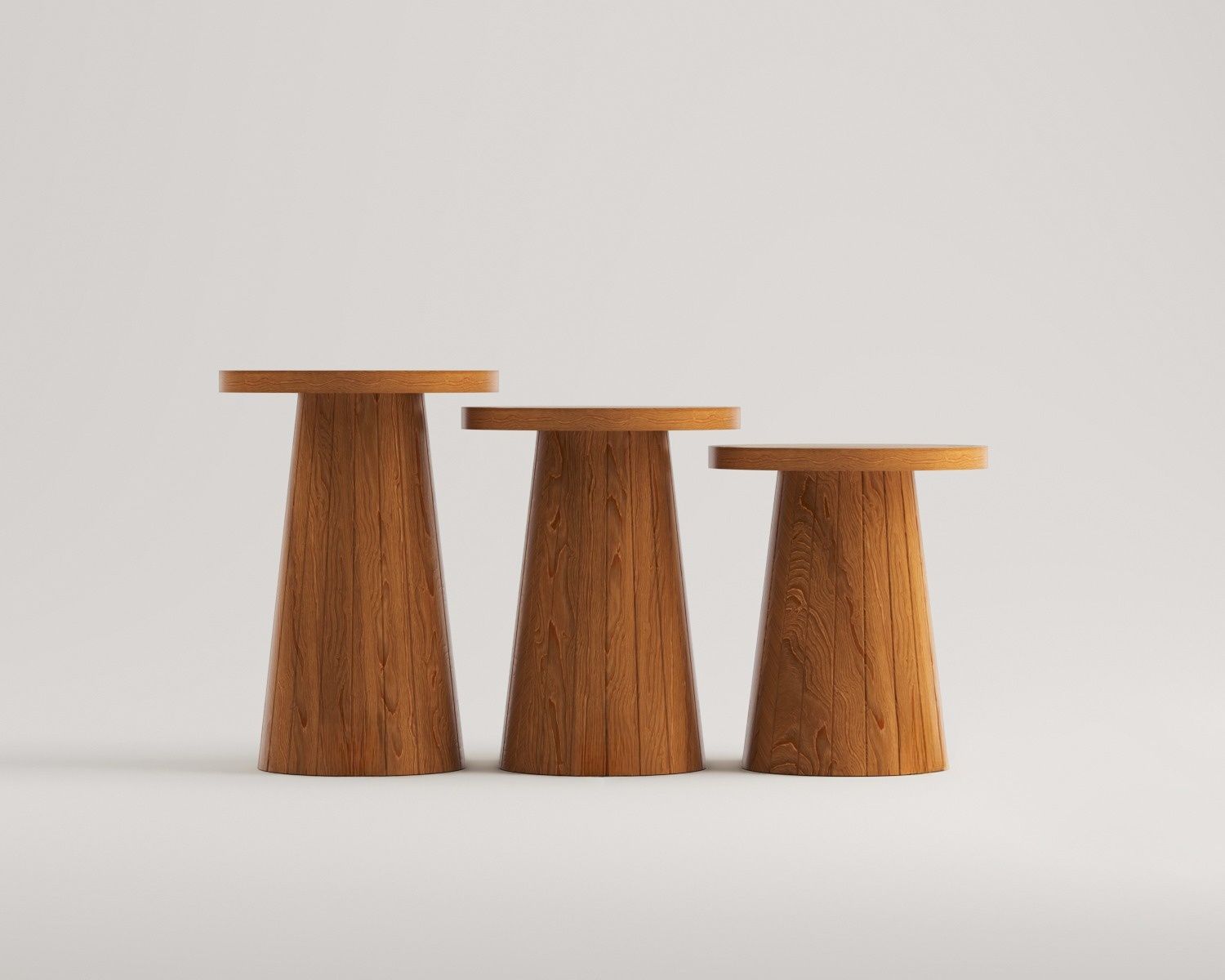 Luzione triple wooden side tables in varying heights with minimalist design, round tops, and conical bases showcasing natural wood grain