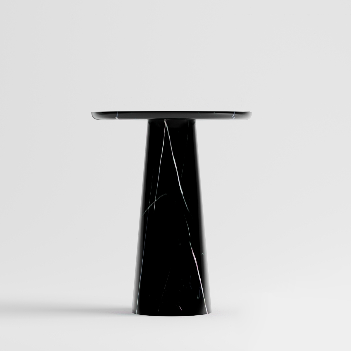 Sleek Luzione black marble side table with white veining, round top, and conical base. 