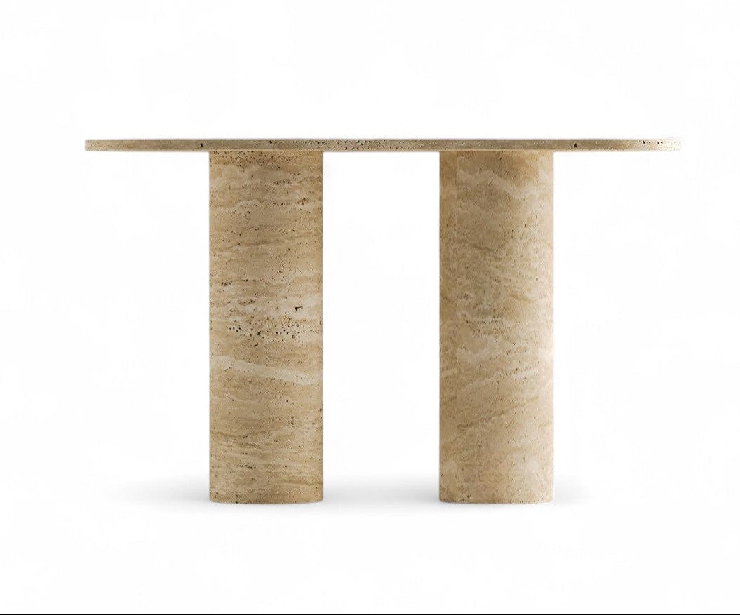 Studio view of beige travertine console table with two cylindrical bases.
alt text: Travertine console table with two cylindrical bases on white background
