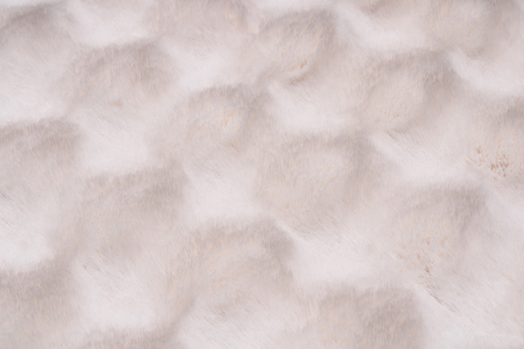 Close up view of white faux fur fabric texture