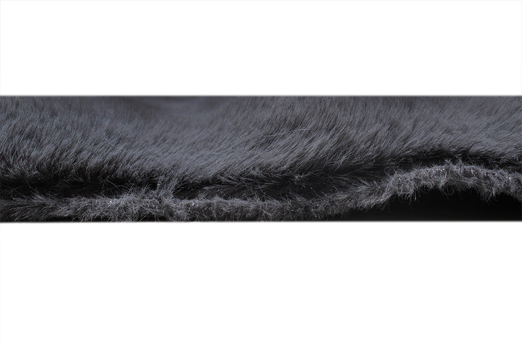 Close up view of gray faux fur rug edge