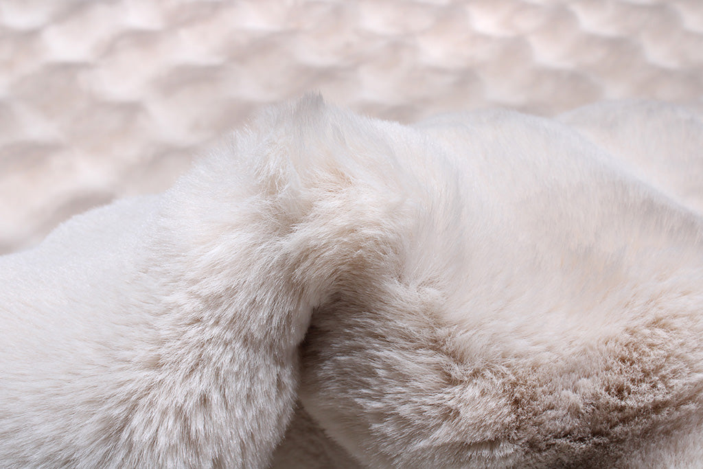 Close up view of white faux fur blanket texture