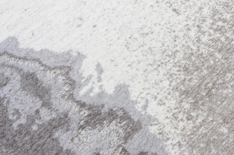 Close up of white and gray abstract patterned rug texture