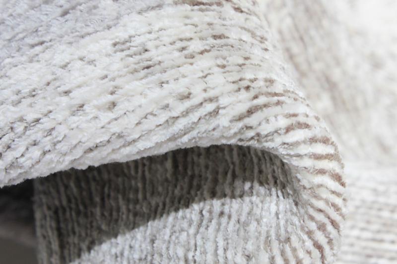 Close up view of white and brown patterned rug texture
