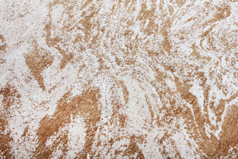 Close up view of brown and white patterned rug texture