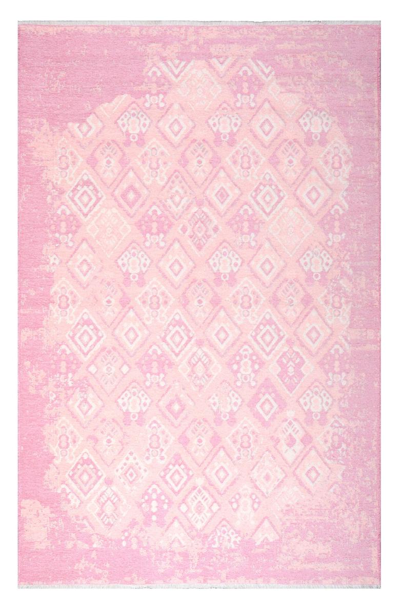 Pink and white geometric patterned area rug with distressed look