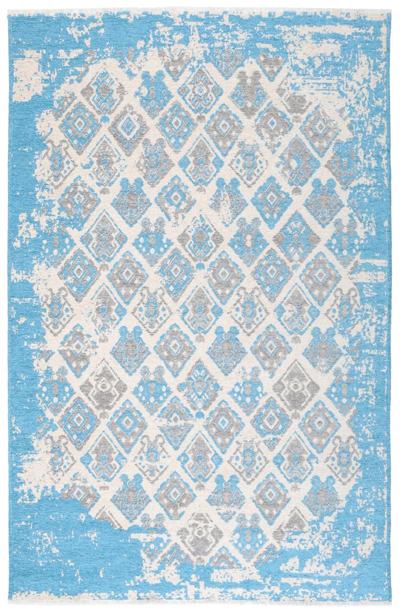 Overhead view of blue gray white distressed geometric patterned rug