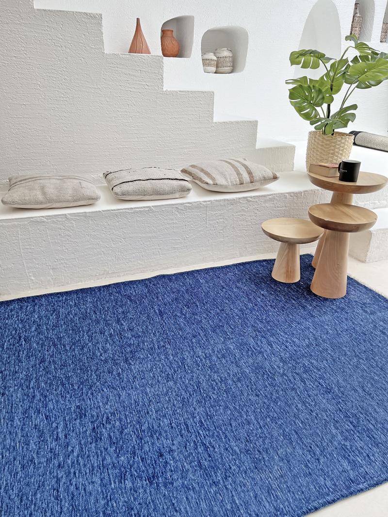 Front view of Moretti Plain Rug showcasing its ocean blue design, perfect for minimalist home decor.