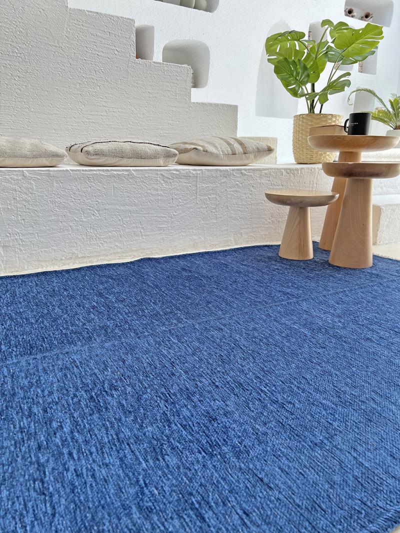 Front view of Moretti Plain Rug showcasing its ocean blue design, perfect for minimalist home decor.