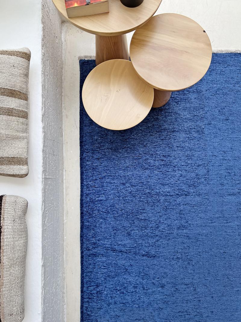 Close-up of Moretti Plain Rug's texture, highlighting the quality of its beige fibers.