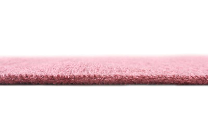 Close up view of pink rug edge texture