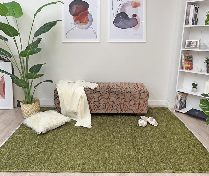Moretti Plain Rug placed in a tranquil reading nook, adding warmth and simplicity to the space.