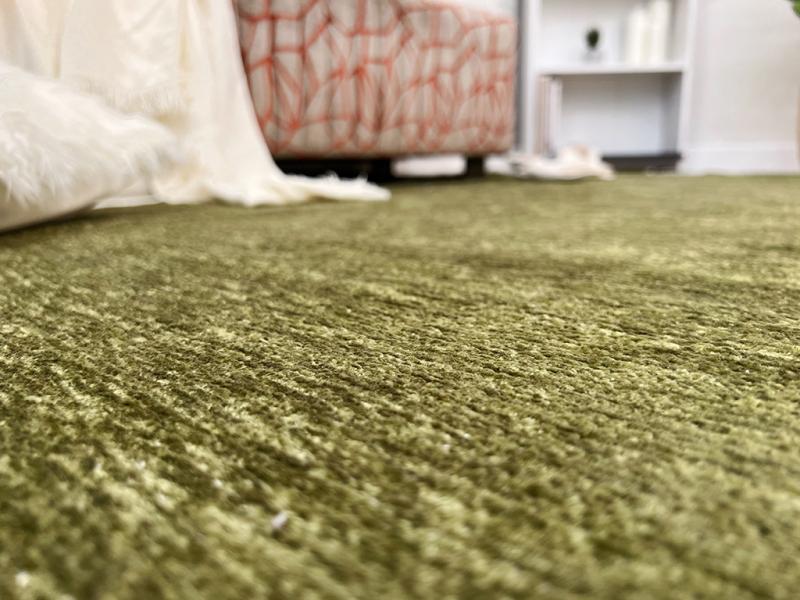 Moretti Plain Rug placed in a tranquil reading nook, adding warmth and simplicity to the space.