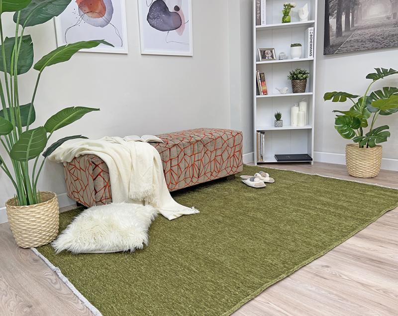 Moretti Plain Rug placed in a tranquil reading nook, adding warmth and simplicity to the space.
