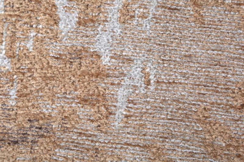 Close up of brown and white textured rug fibers