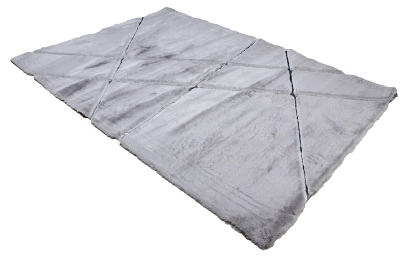 Close-up of Rabbit Fur Rug's soft texture, showcasing the luxurious feel of the gray and silver fur.