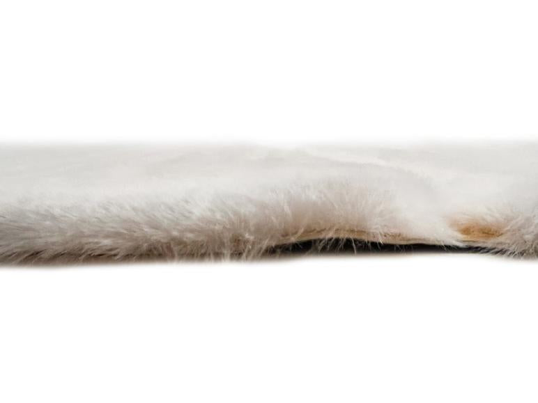 Rabbit Fur Rug placed in an upscale office, adding a touch of elegance with its cream and gold design.