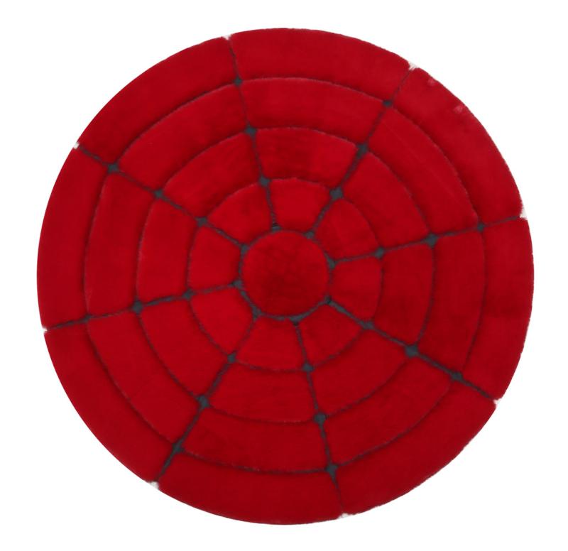 Front view of Rabbit Round Fur Rug in bold red and black colors, enhancing unique decor styles in a modern living room.