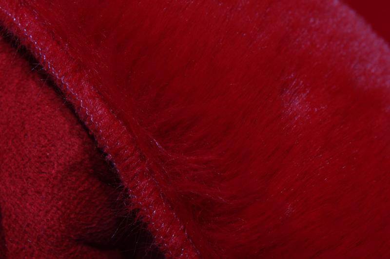 Red faux fur fabric texture detail upholstery material