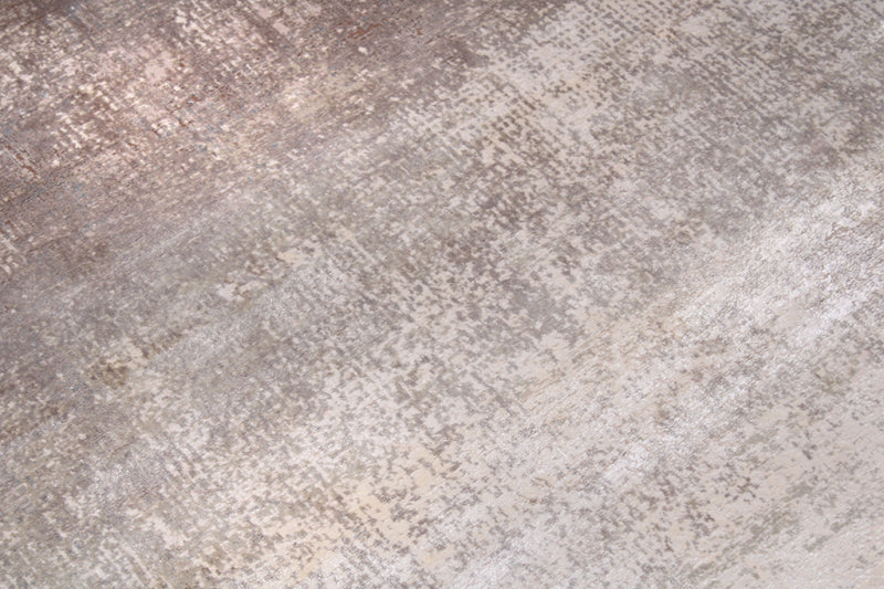 Close up view of gray and beige abstract pattern rug texture