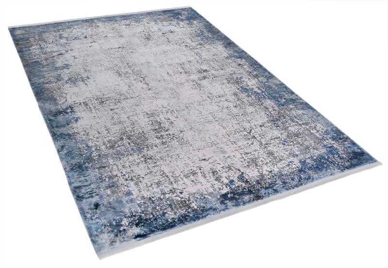 Luzione 857 modern area rug featuring an abstract design with blue and gray tones. Perfect for living rooms and bedrooms.