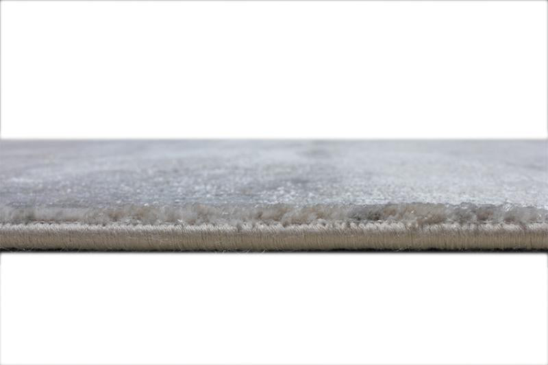 Angled view of Lexus Modern Rug under a modern furniture setup, demonstrating its integration into stylish living areas.