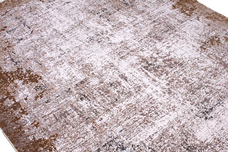 Lexus Rug placed in a living room setting, enhancing the space with its warm brown tones and elegant design.