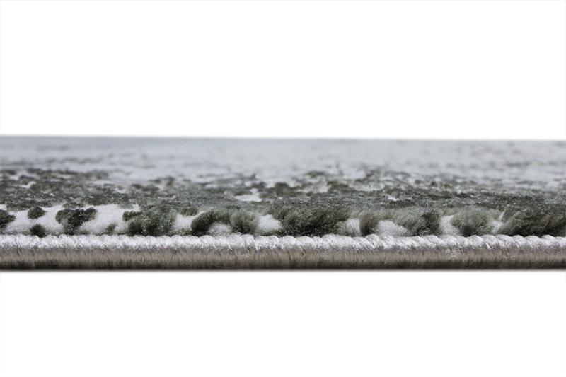 Close up view of gray patterned area rug edge