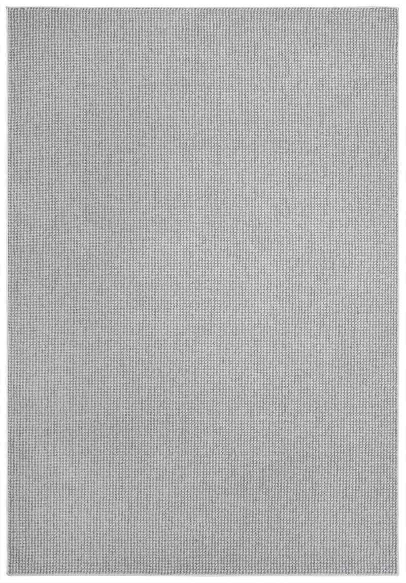 Close-up of the Nairobi Rug's fibers, emphasizing its soft texture and versatile gray shade that complements various styles.