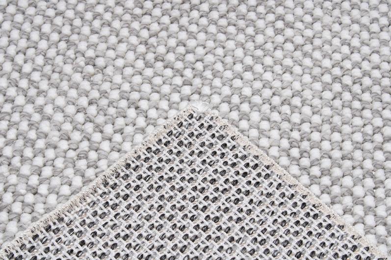 Nairobi Rug displayed in a minimalist living space, providing a subtle and sophisticated touch with its neutral design.