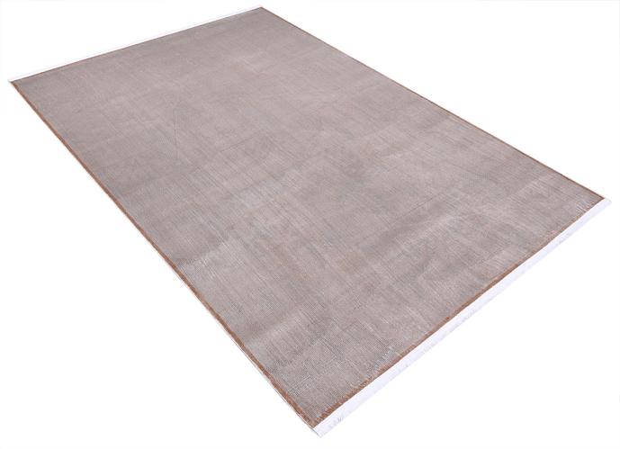Close-up of the Infiniti Rug's texture, emphasizing its soft fibers and neutral beige palette that complements various decors.